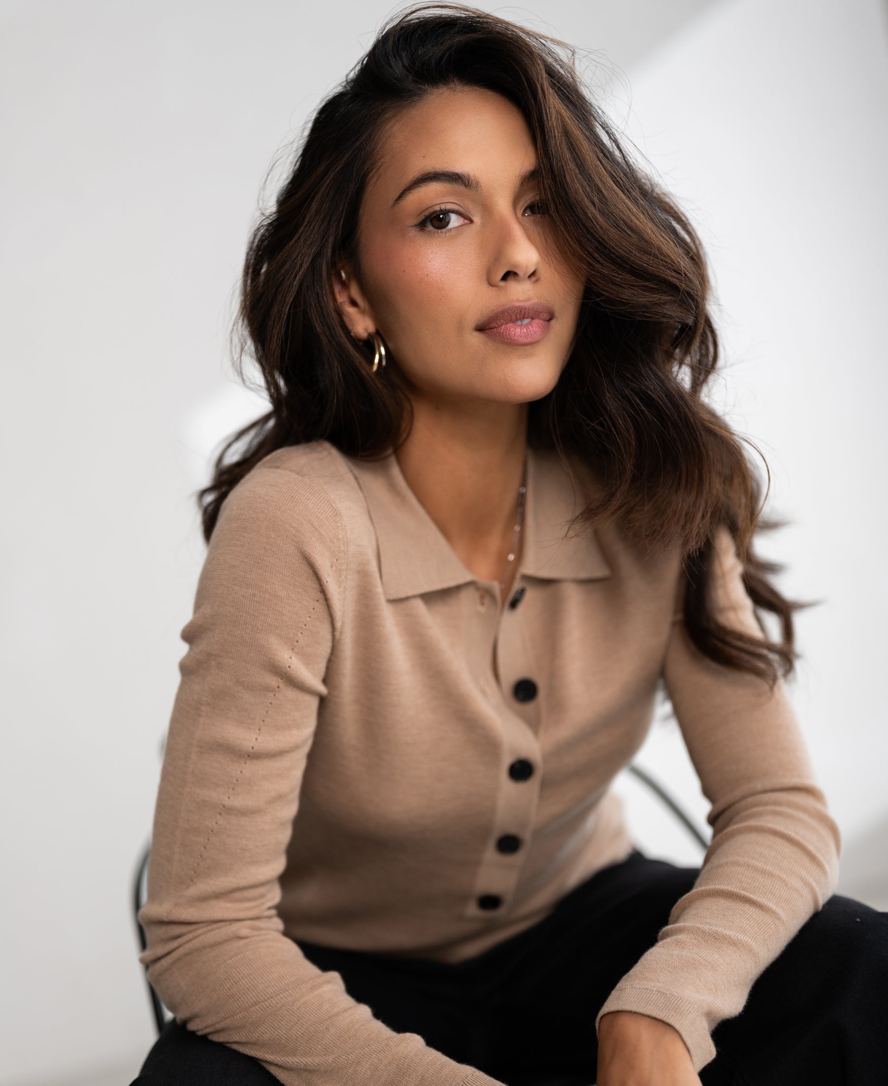 Soft camel merino wool polo shirt in a classic style, shown from the front.
