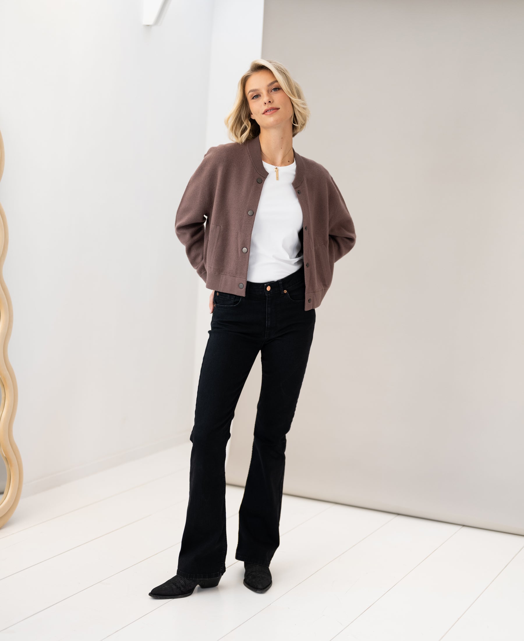 PLEIN PUBLIQUE bomber jacket in light-colored "Innuendo" shade, shown indoors.
