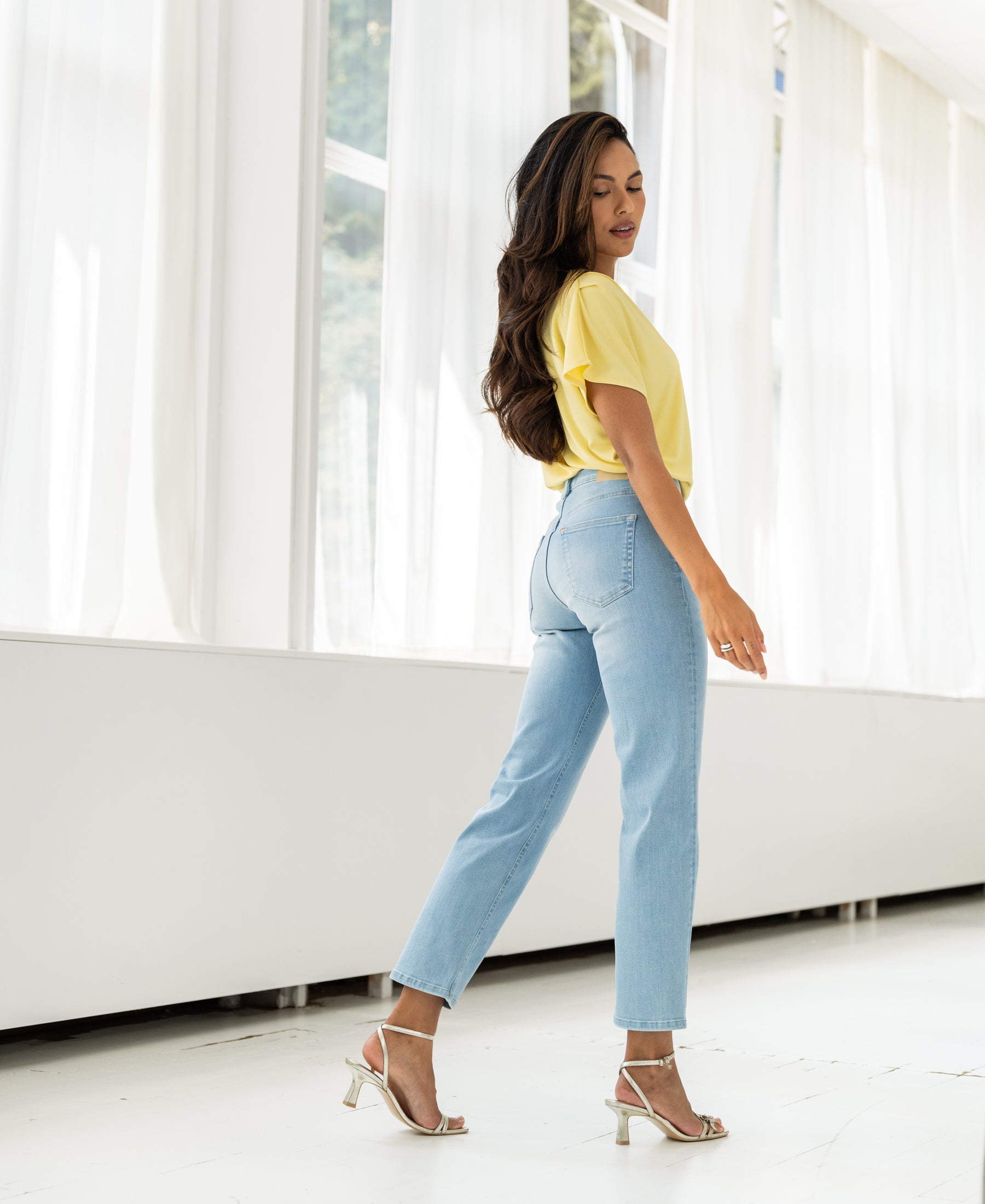 Cropped LE GUY Bleached jeans by PLEIN PUBLIQUE shown worn, featuring a light wash, in a bright room.