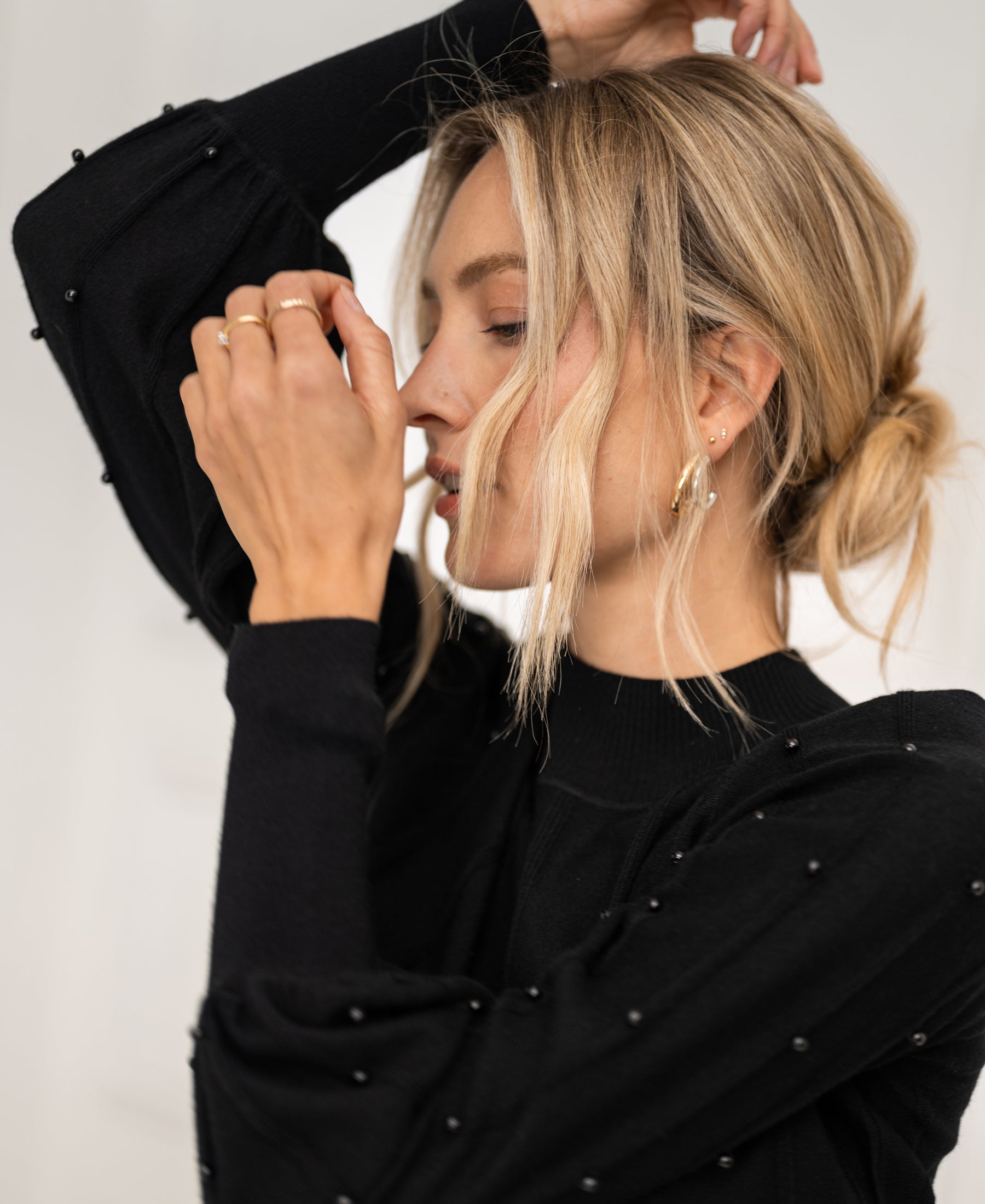 Black LA CENTAINE beaded turtleneck sweater by PLEIN PUBLIQUE, front view.