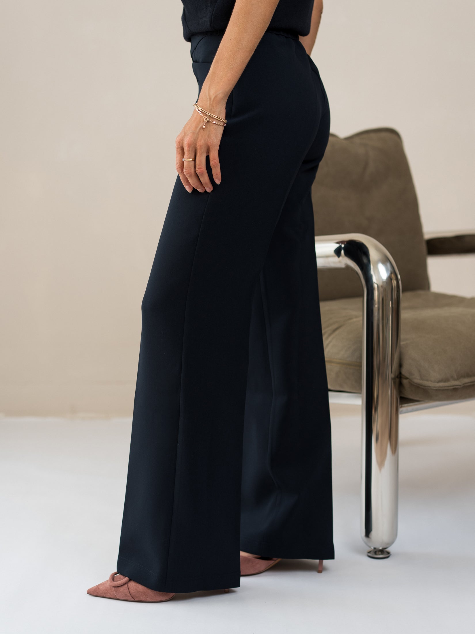 Navy blue tailored pants from PLEIN PUBLIQUE shown on a model.