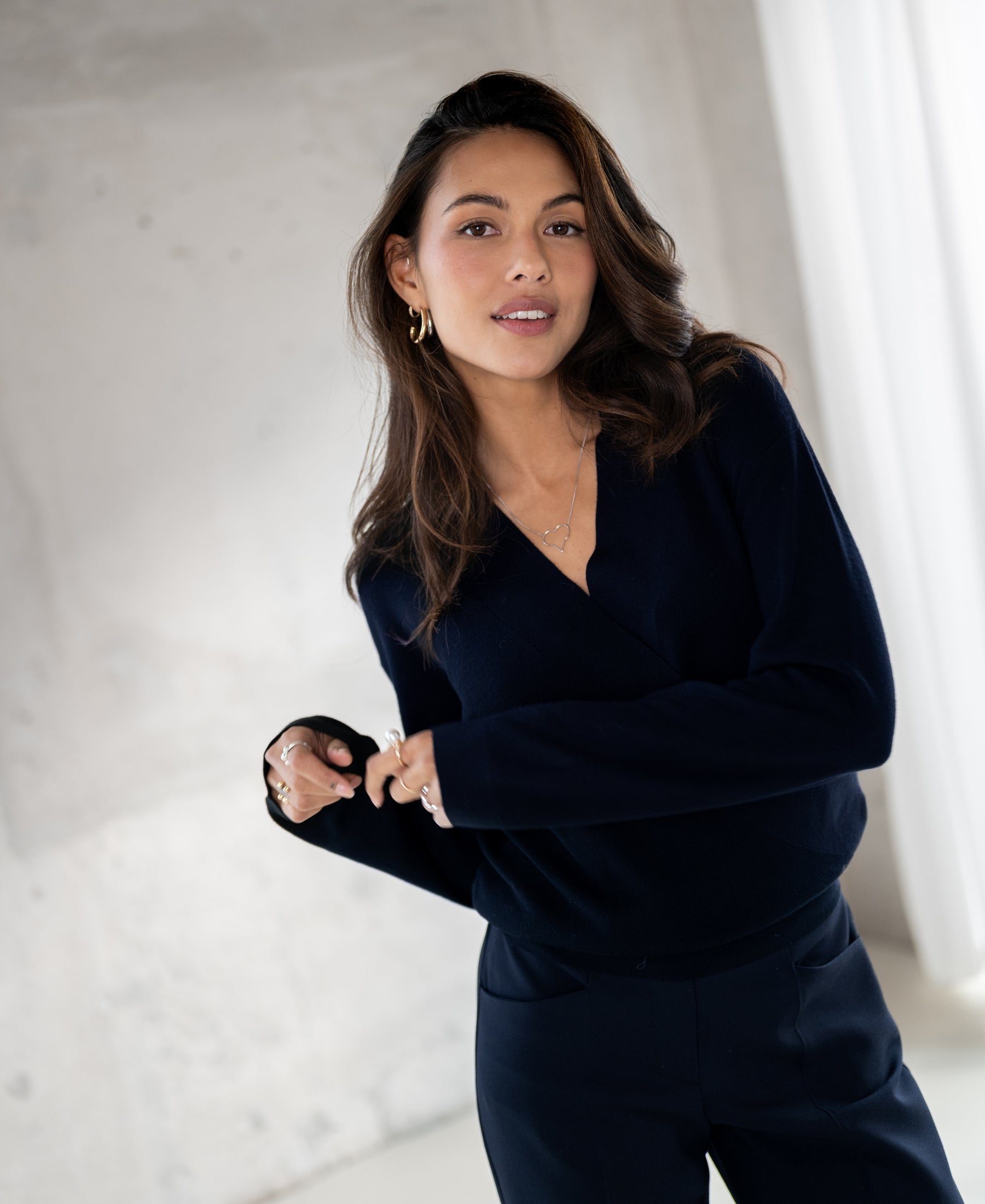 Dark blue wrap sweater LES CINQ by PLEIN PUBLIQUE, shown indoors.