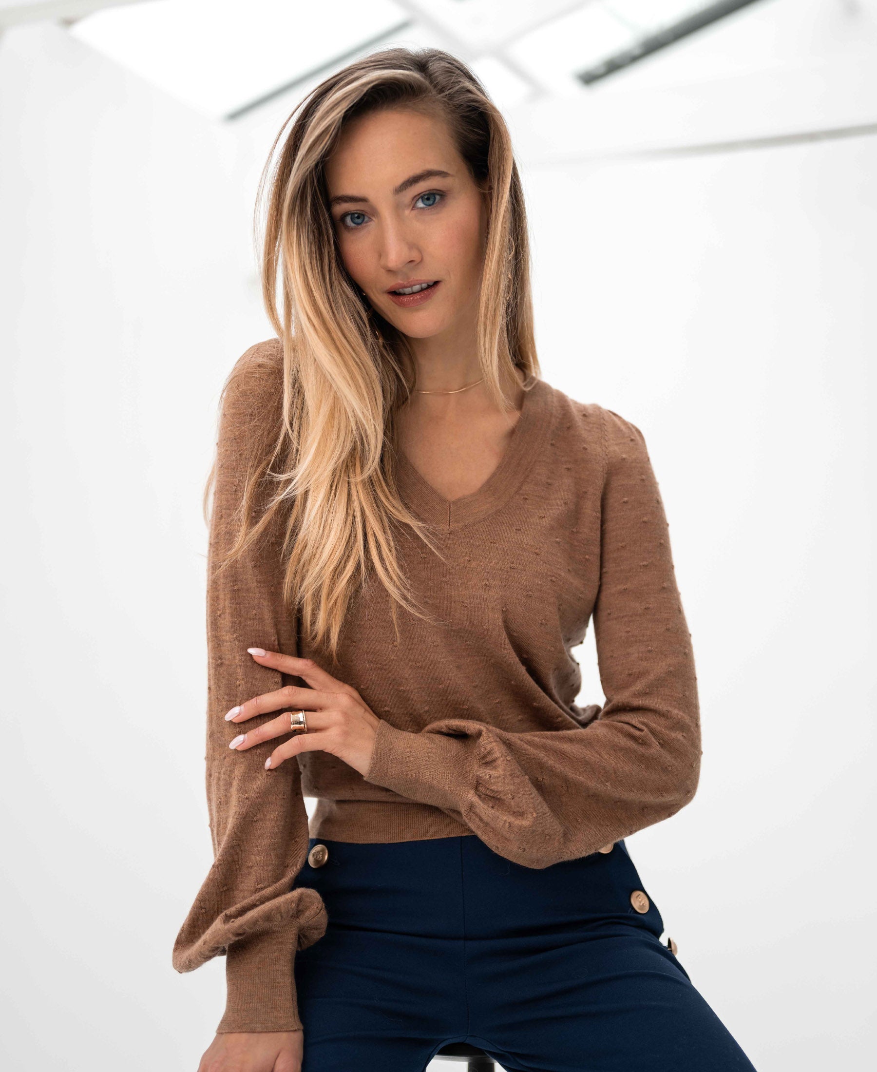 PLEIN PUBLIQUE Merino wool V-neck sweater in Chai Tea on white background.