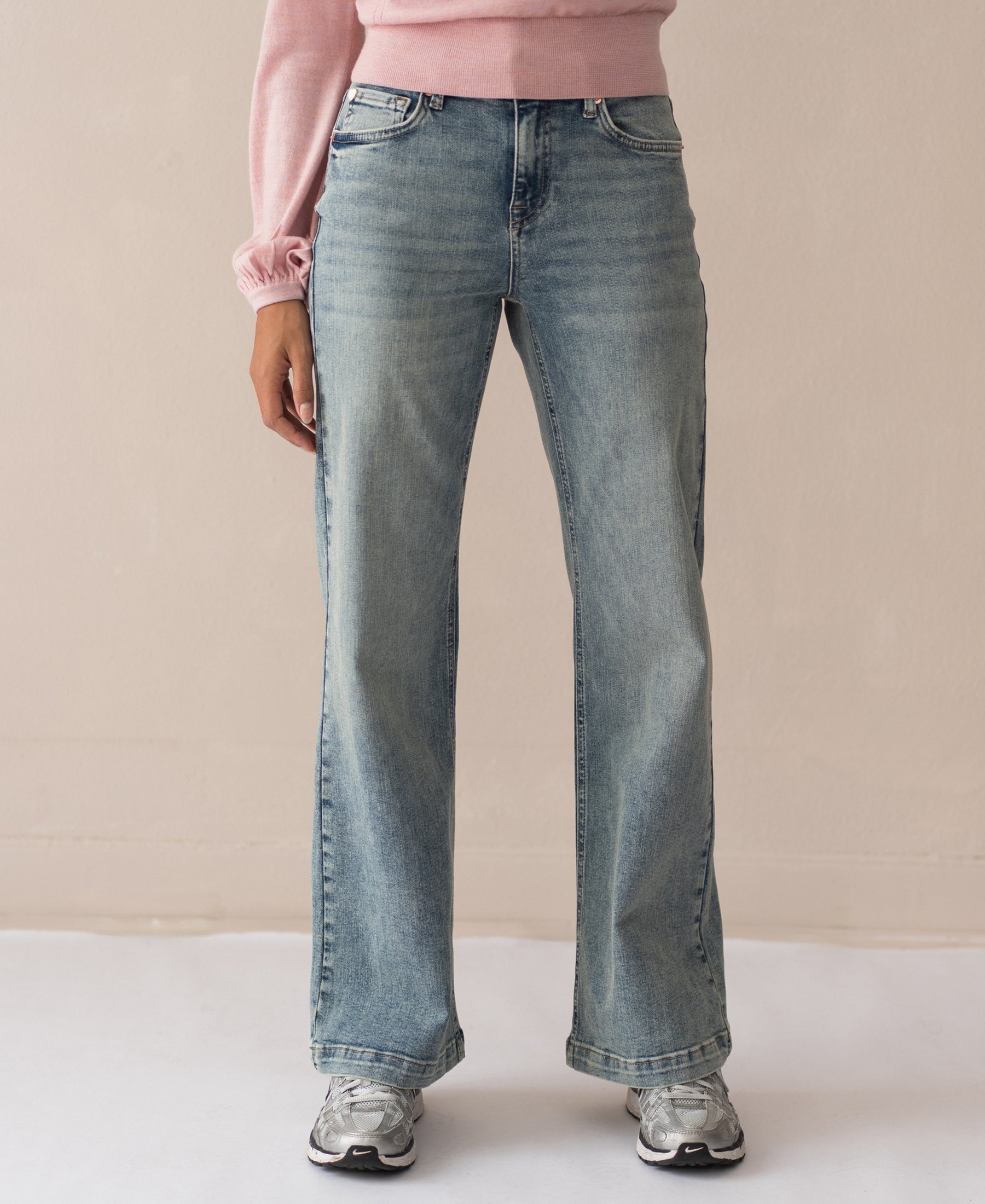 Wide leg jeans by Plein Publique in vintage wash, shown against a plain background.