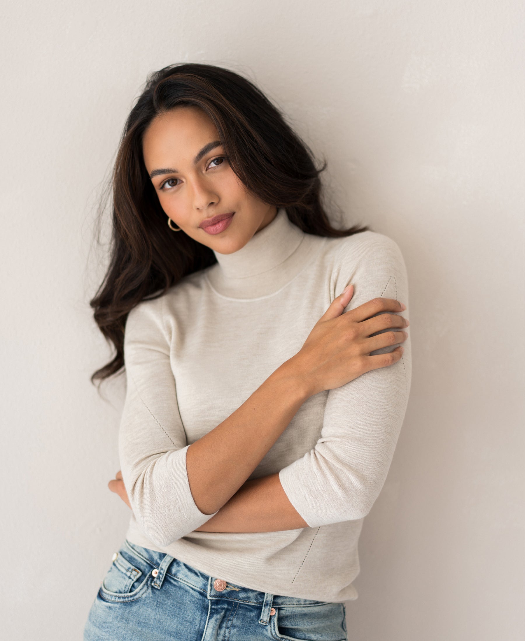 Beige turtleneck sweater by PLEIN PUBLIQUE LE FABIAN shown on model against a light background.