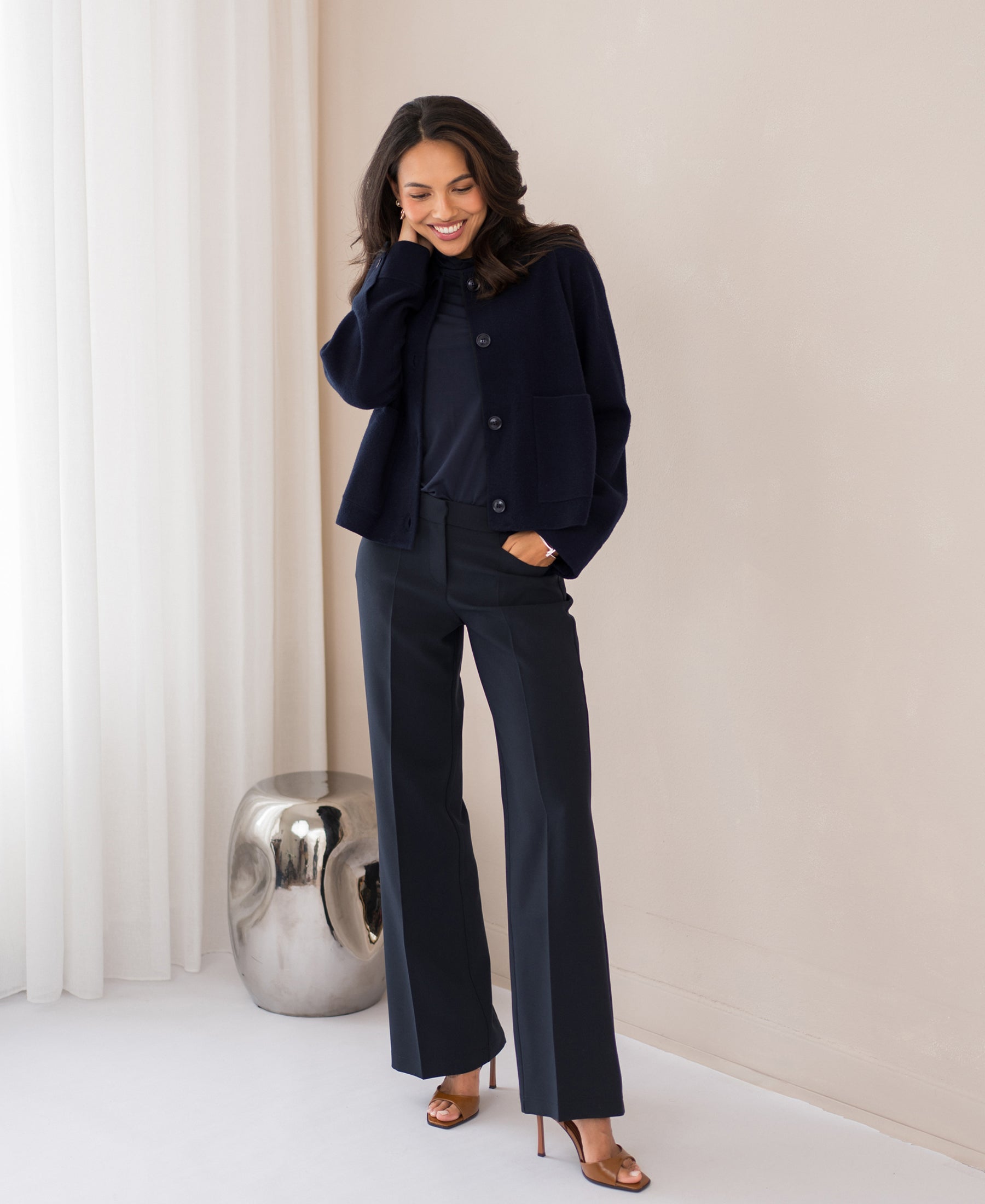 Navy blue wool blazer LA FAYE by PLEIN PUBLIQUE shown indoors.