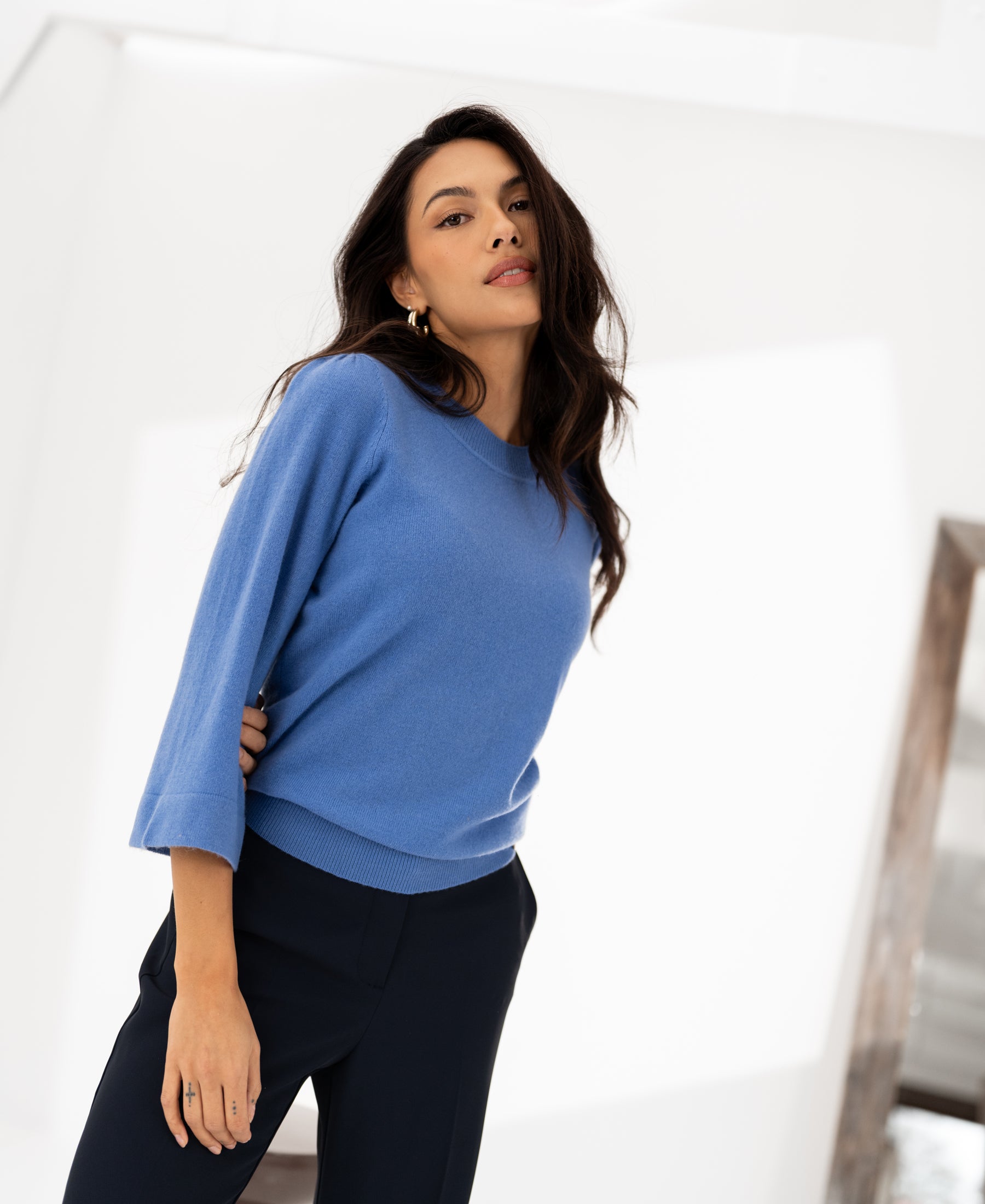 Lavender-blue merino wool sweater with 3/4 kimono sleeves, shown on a woman against a white background.