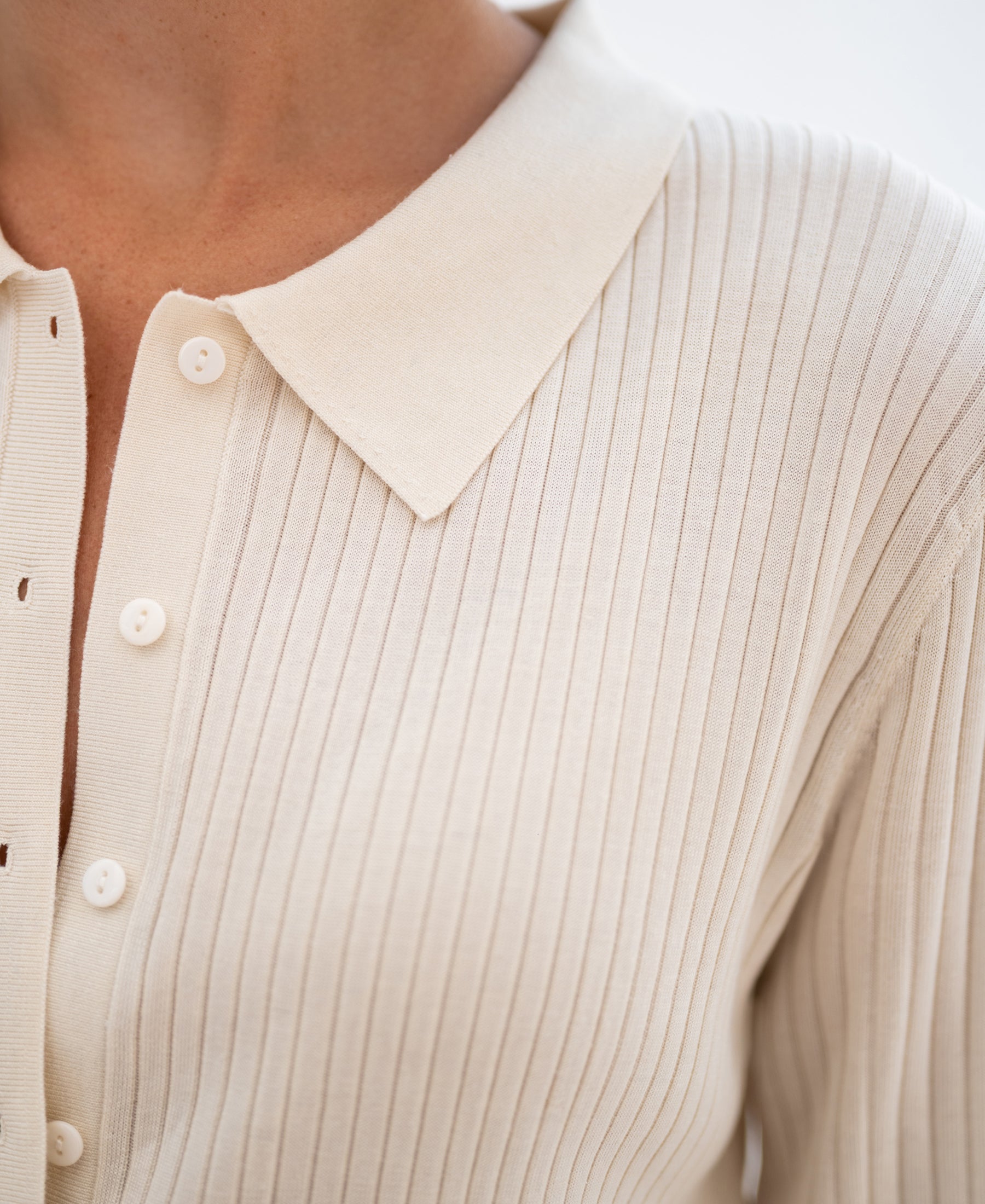 Close-up of a cream Tencel-silk ribbed cardigan from PLEIN PUBLIQUE, LA JOSH style.