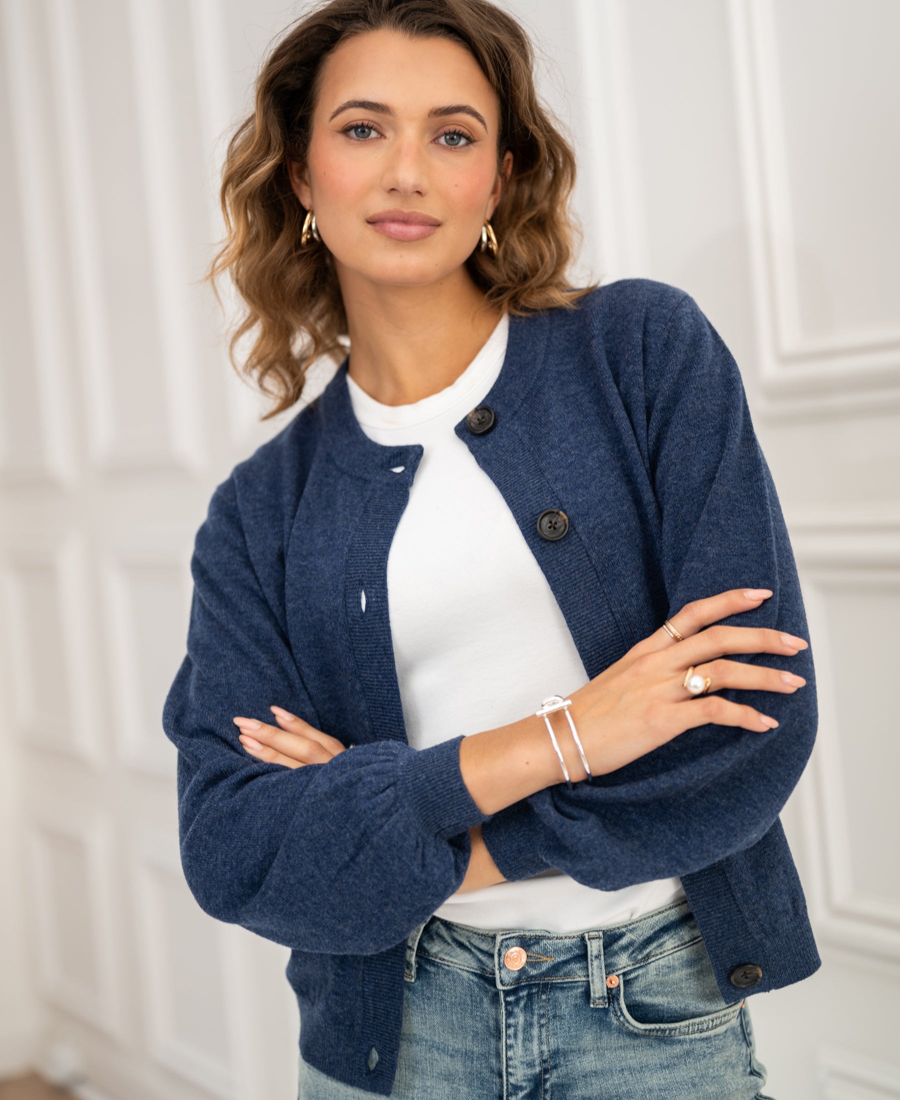 Indigo blue round neck vest by PLEIN PUBLIQUE, LA LEA style, shown in a bright room.
