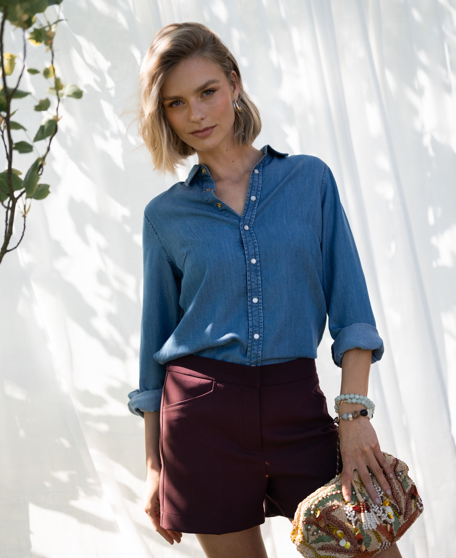 Bordeaux PLEIN PUBLIQUE LA MADDY shorts shown outdoors in sunlight.