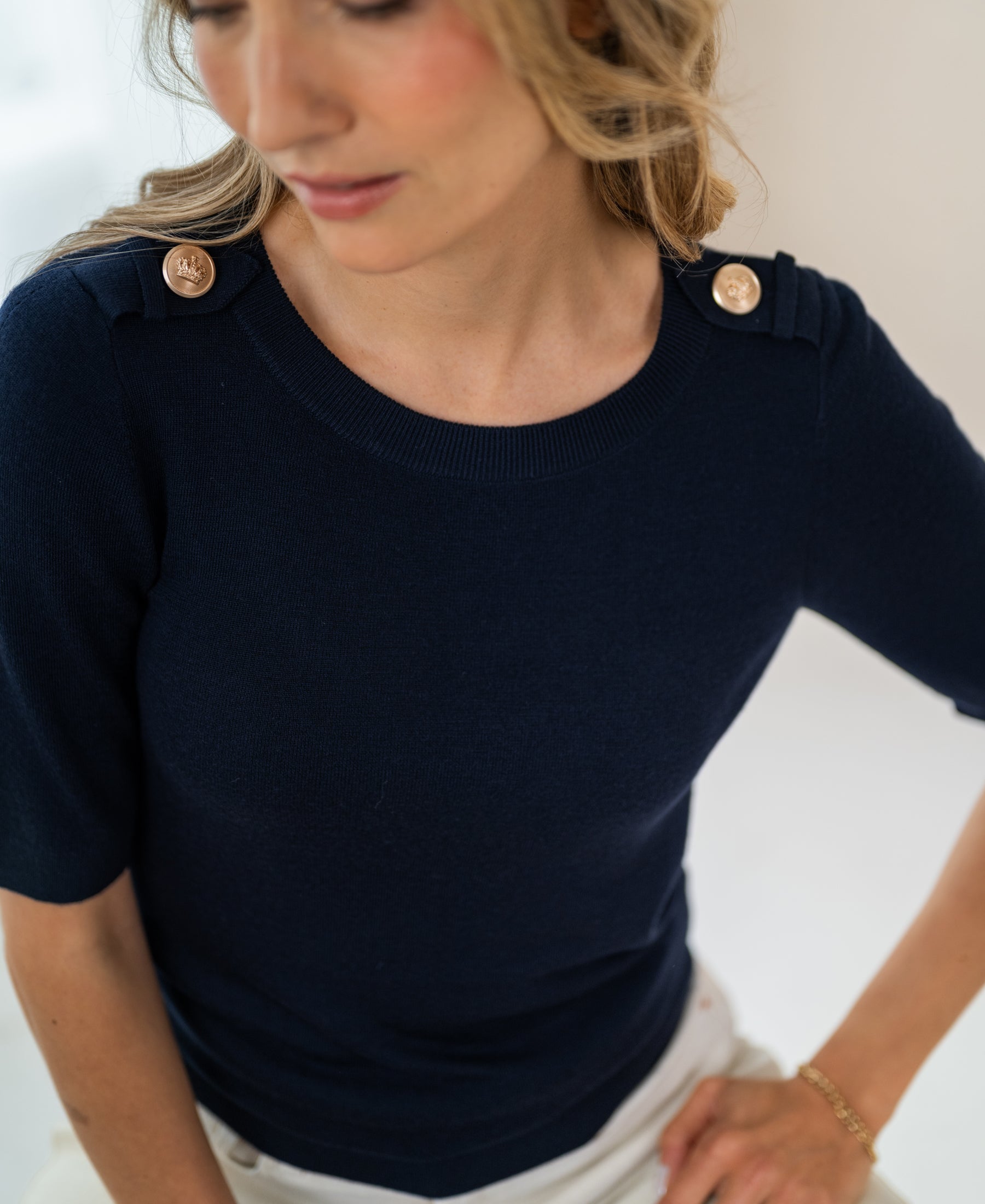 Navy blue Merino wool sweater with gold epaulettes.
