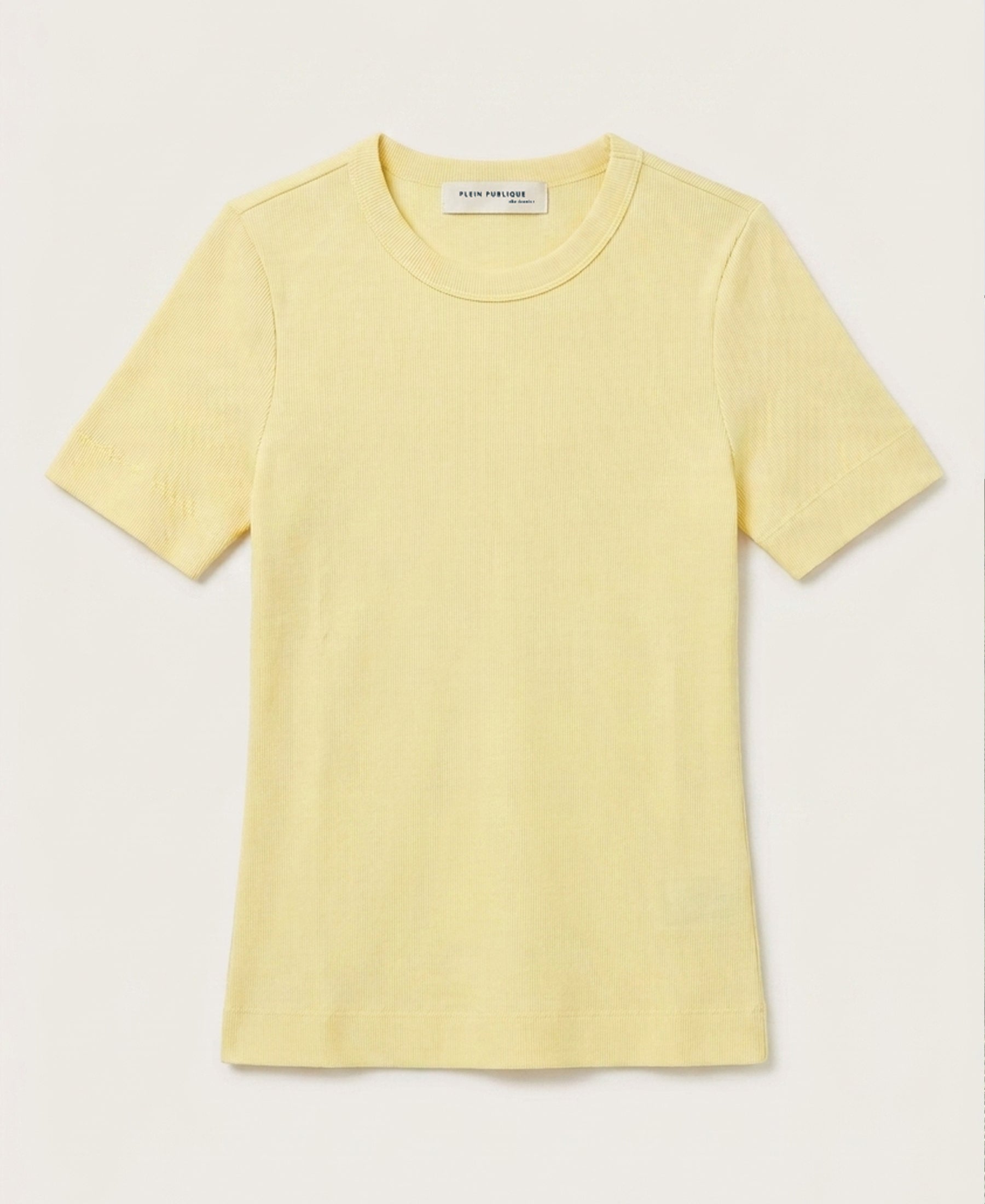 PLEIN PUBLIQUE luxe soft T-shirt in soft yellow, short-sleeve crew neck, laid flat on a light background.