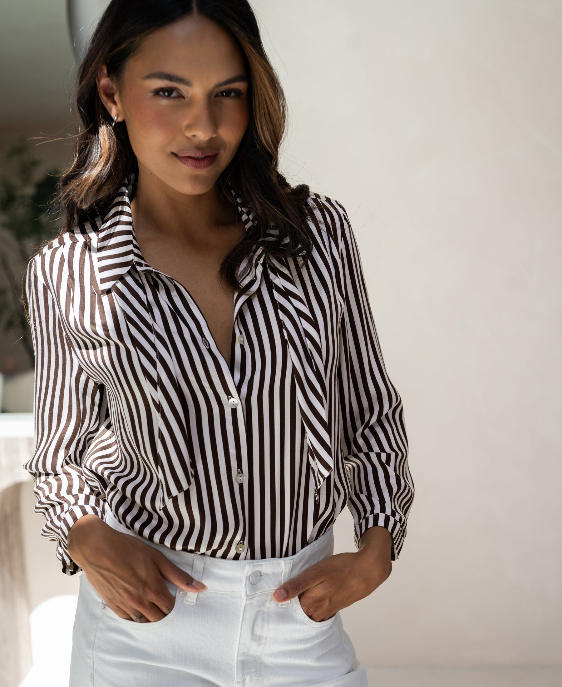 Ivory-cocoa striped PLEIN PUBLIQUE blouse with tie detail, LA MINOU style, shown indoors.