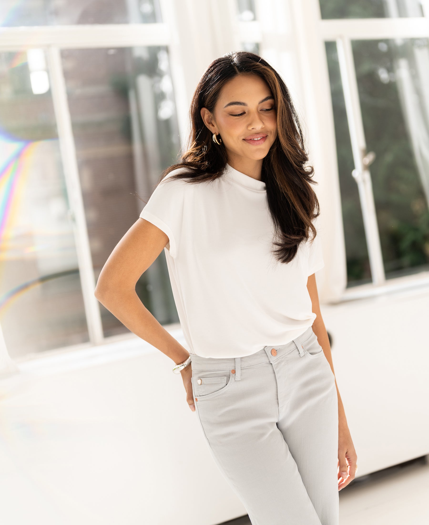 Ivory ribbed collared top by PLEIN PUBLIQUE displayed in bright natural light.
