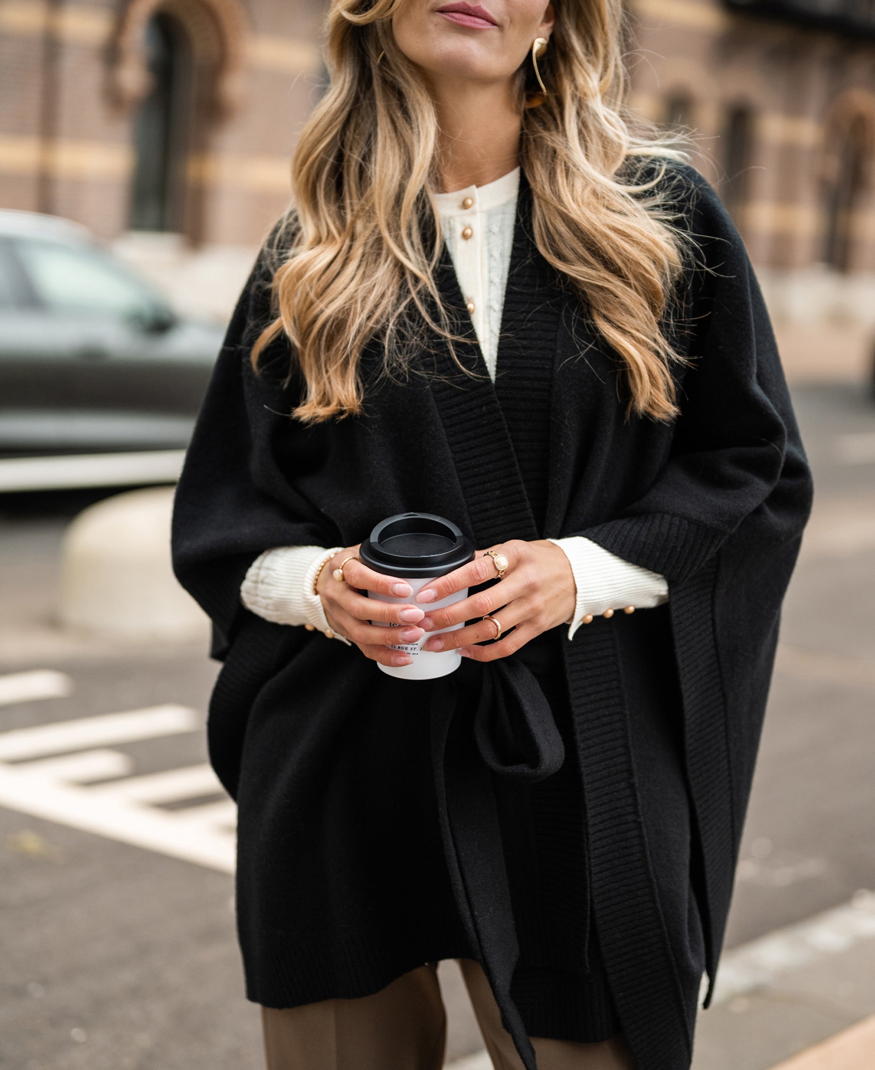 Black Merino wool poncho from PLEIN PUBLIQUE.