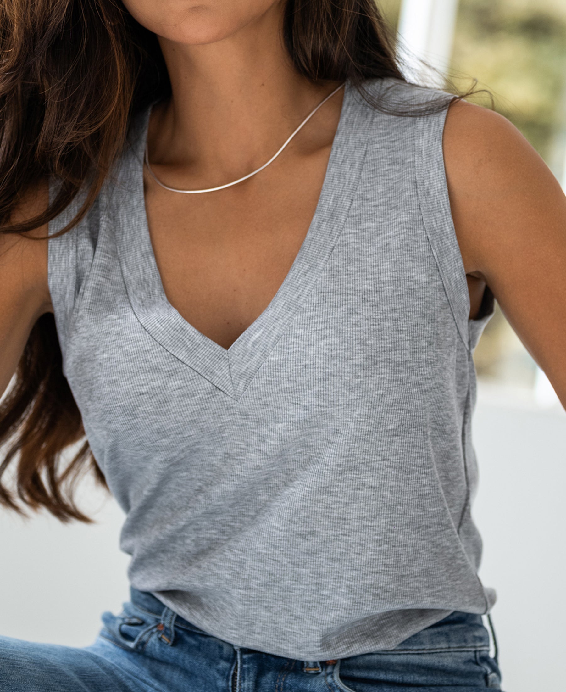 Woman wearing a light grey lyocell top.