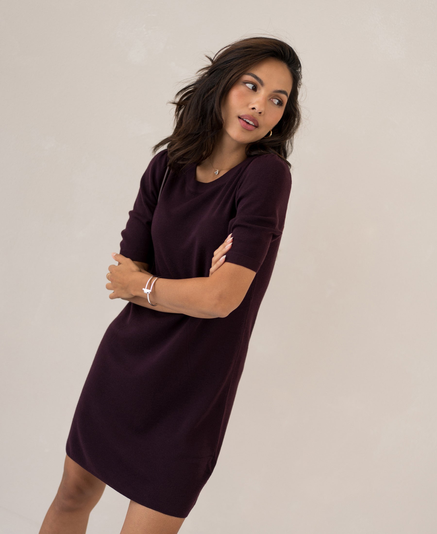 Aubergine wool dress LA TWIGGY by PLEIN PUBLIQUE shown on woman against light background.