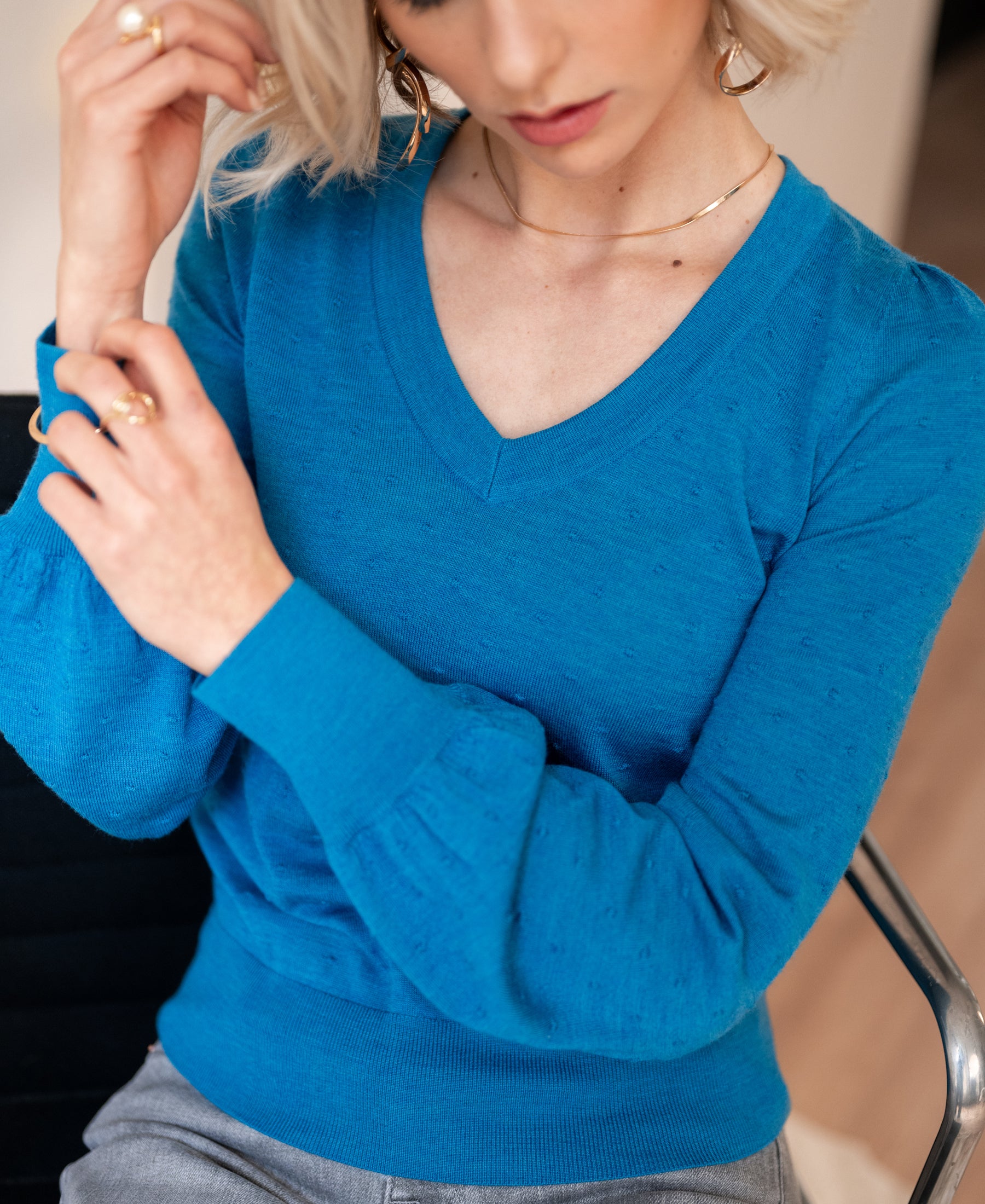 PLEIN PUBLIQUE Merino wool V-neck sweater LA VICTORIA in sea blue, shown with sleeve adjust.