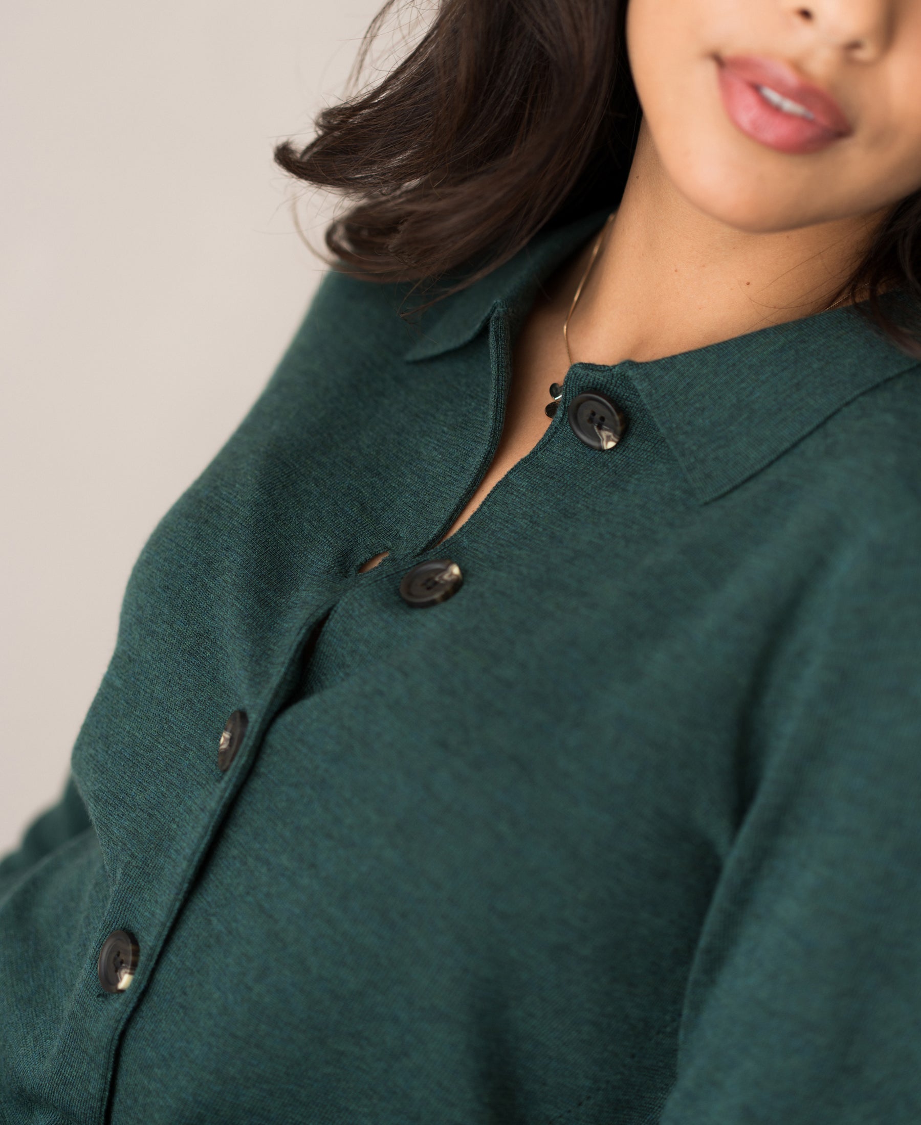 Close-up of a greenish PLEIN PUBLIQUE polo-collar vest, LES VINGT style.