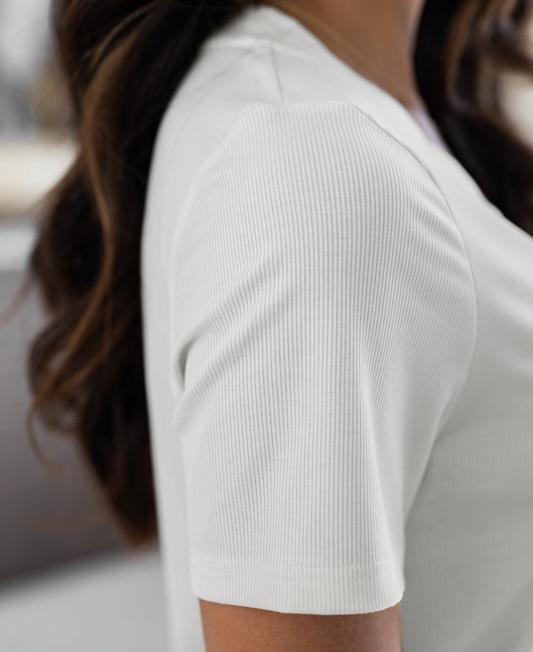 Close-up of the Plein Publique white lyocell T-shirt, showing the shoulder area and texture.
