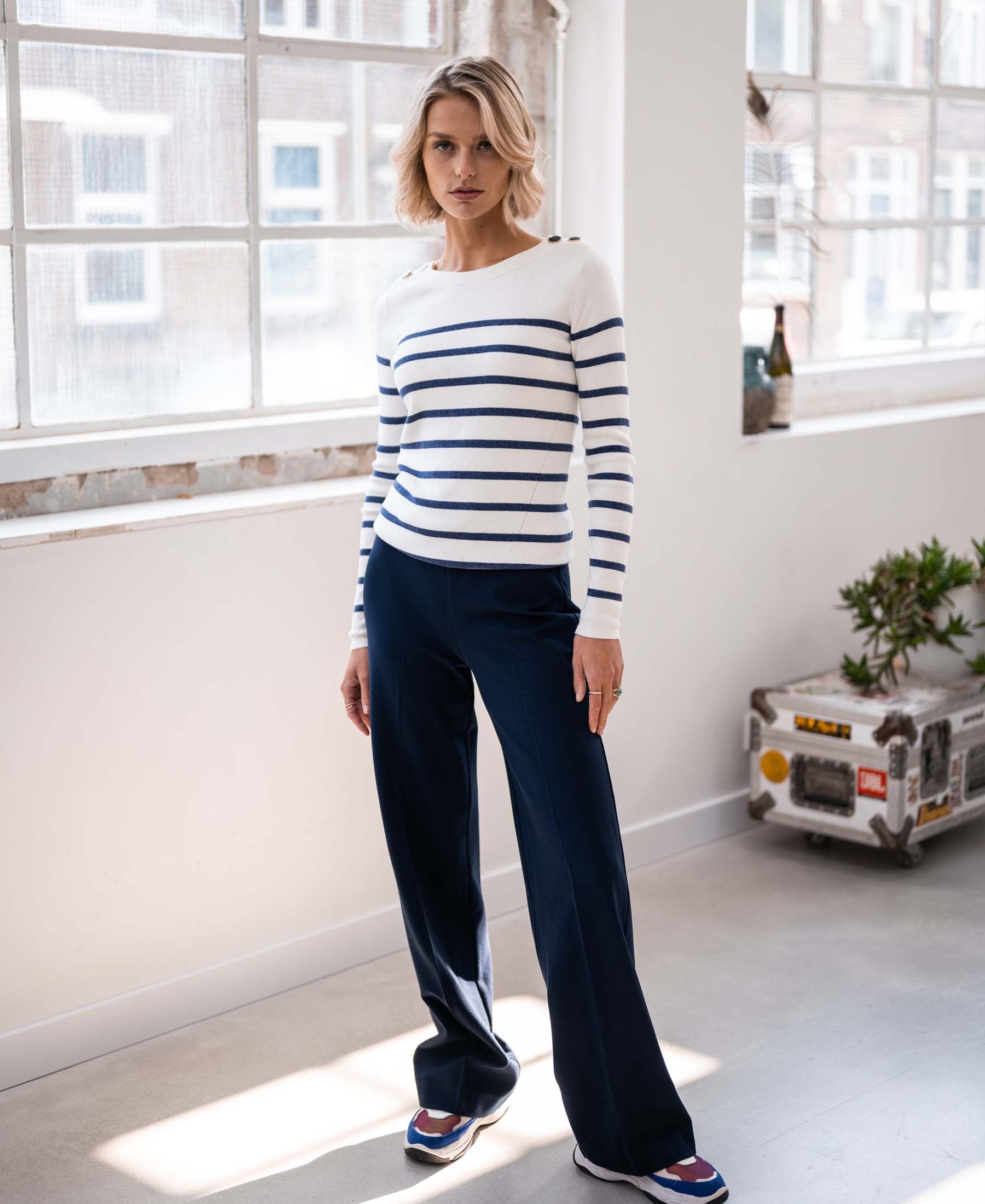 Ivory and denim blue Breton sweater LELISA by PLEIN PUBLIQUE shown in sunlight.