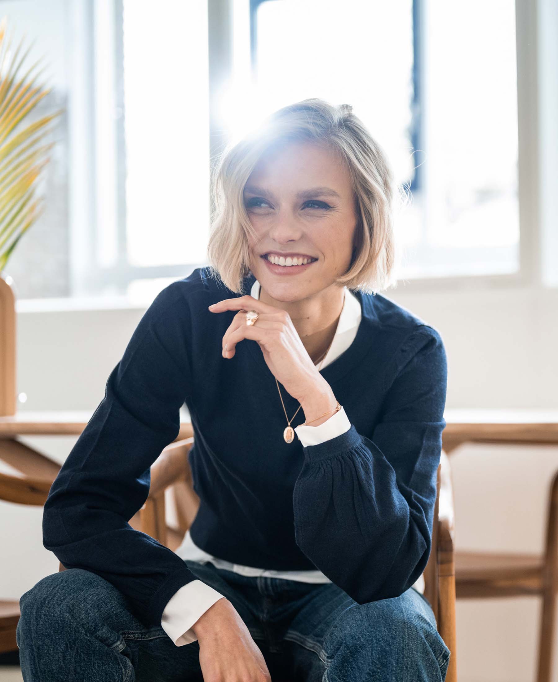 PLEIN PUBLIQUE's Merino Wool Sweater LA COEUR in dark blue shown in natural light.