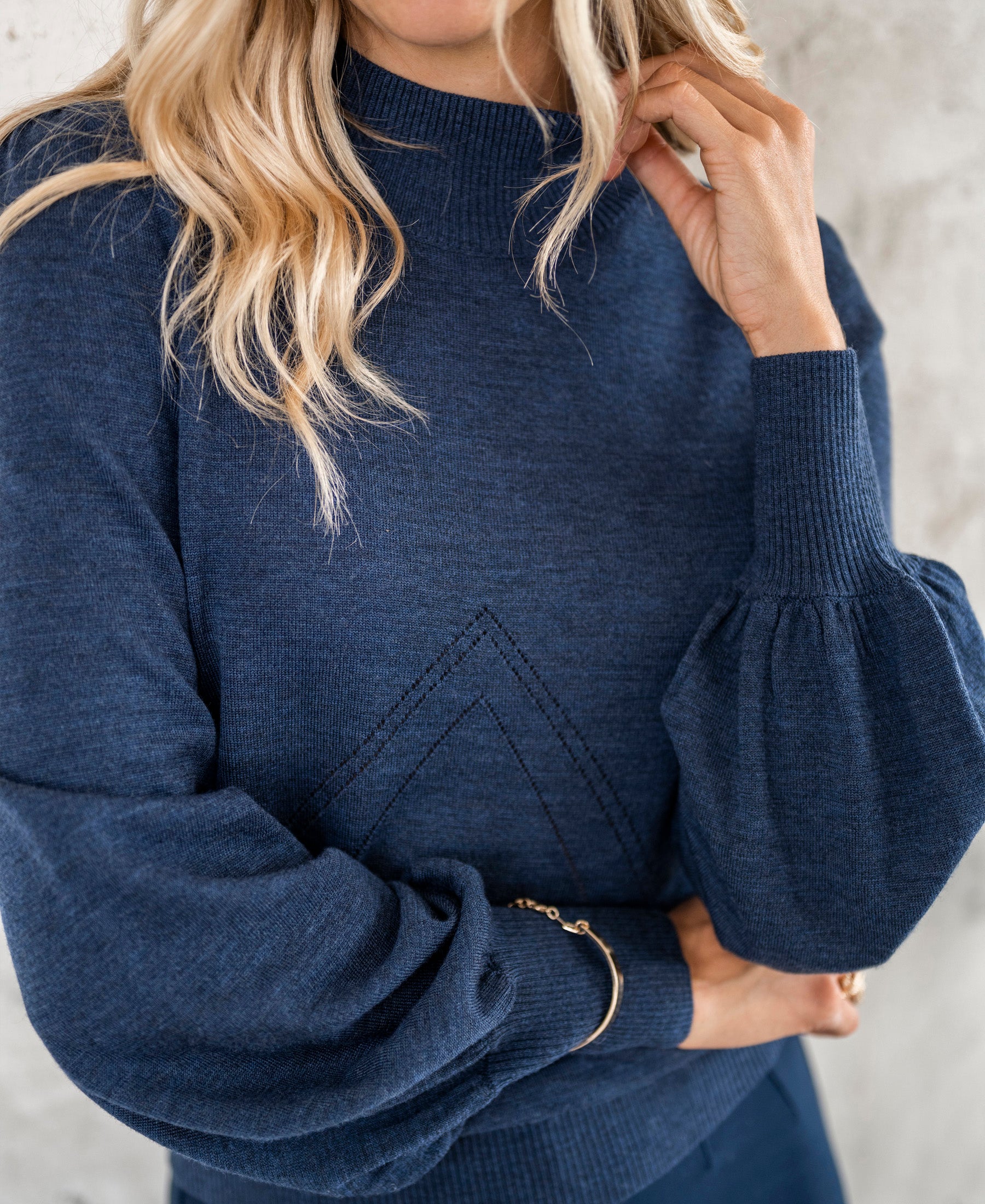 Denim blue turtleneck LES SALLES by PLEIN PUBLIQUE against a light background.