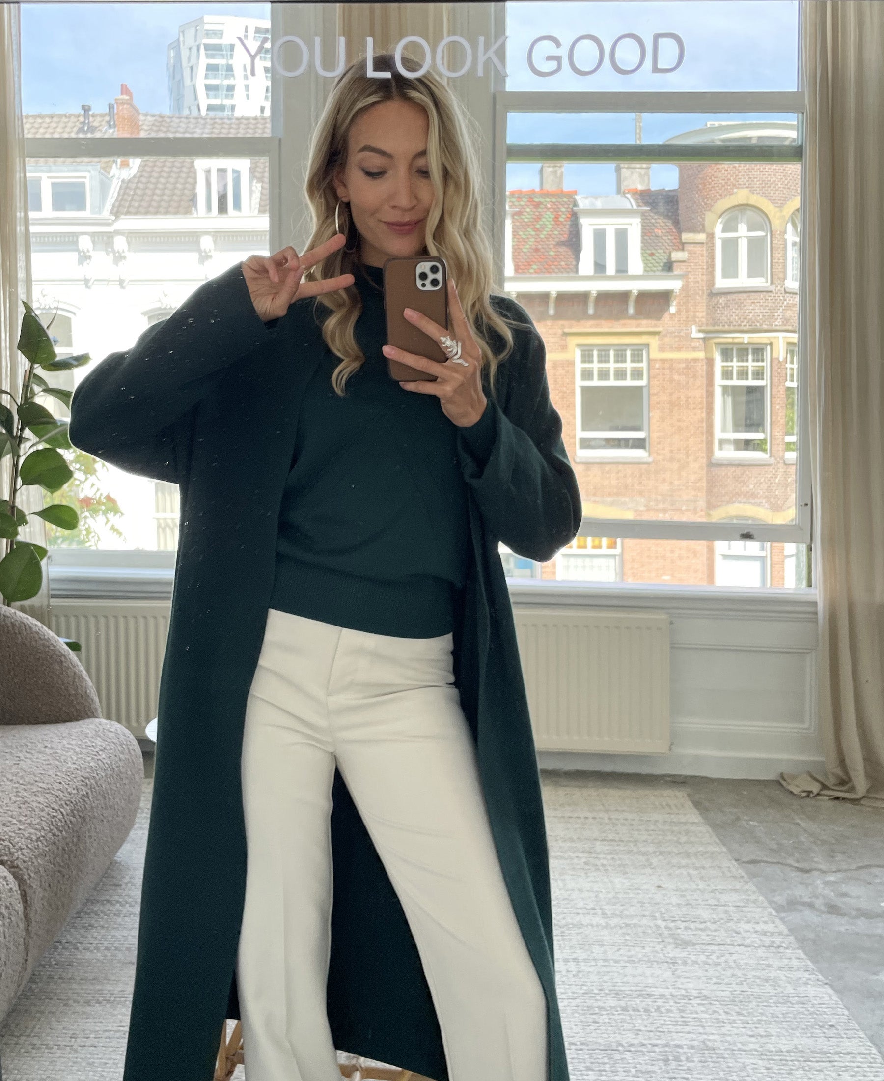 Dark green turtleneck sweater by PLEIN PUBLIQUE shown in mirror view.