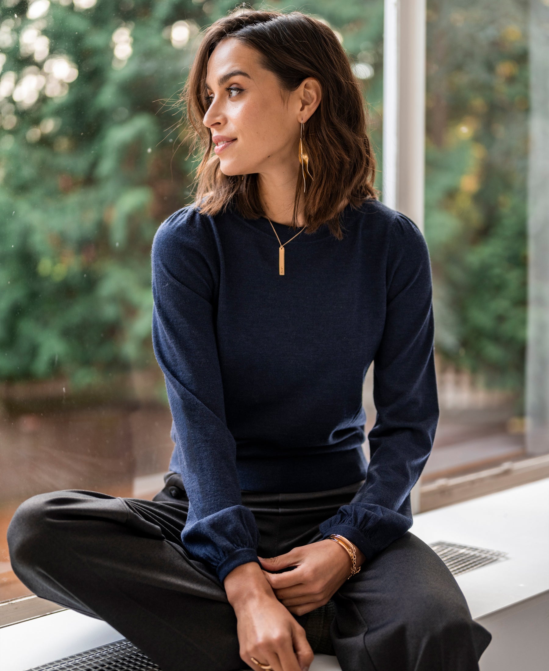 Navy blue PLEIN PUBLIQUE LA COEUR merino wool sweater, side view.