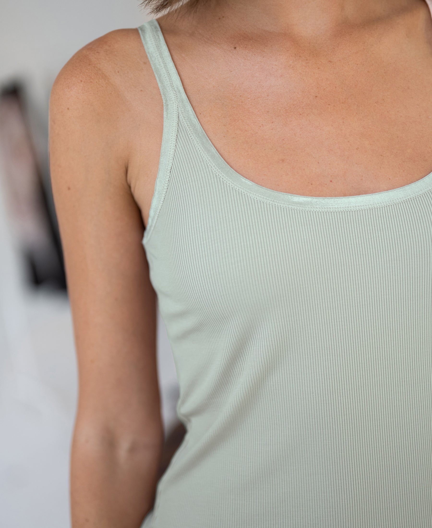 Luxe Cami top in light mist green by PLEIN PUBLIQUE, shown from the waist up.