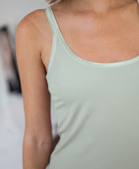 Luxe Cami top in light mist green by PLEIN PUBLIQUE, shown from the waist up.