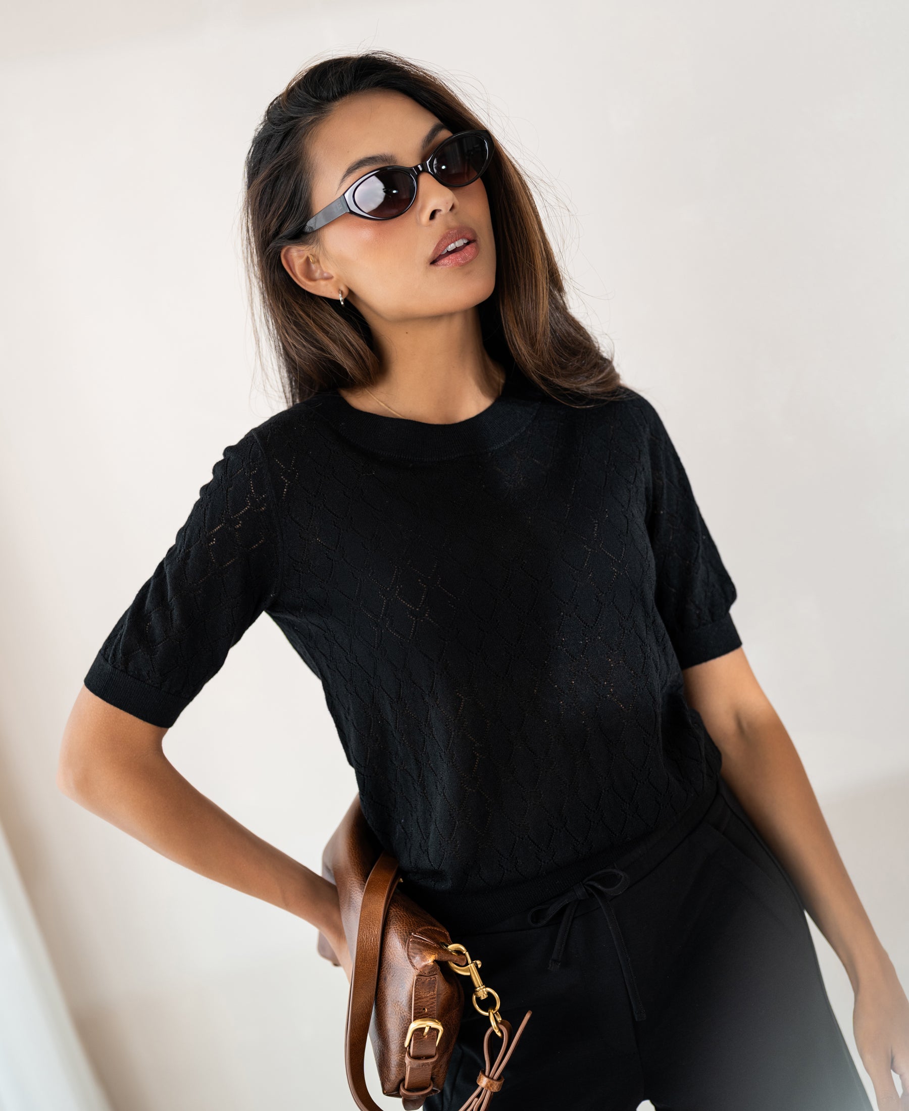 Black heart pattern sweater LE BATTANT by PLEIN PUBLIQUE shown on model against a neutral background.