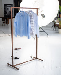 The Striped Shirt LA LOIRE White/Light Blue from PLEIN PUBLIQUE hangs on the rack.