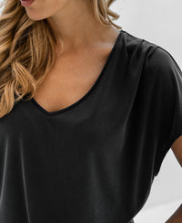 Charcoal ribbed T-shirt, shown from shoulders to lips.