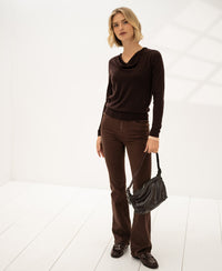 Woman wearing the LA CASCADE Pure Choco waterfall neck sweater from PLEIN PUBLIQUE.