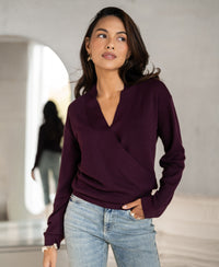 Aubergine wrap sweater by PLEIN PUBLIQUE, style LES CINQ, shown indoors with a mirrored view from behind.