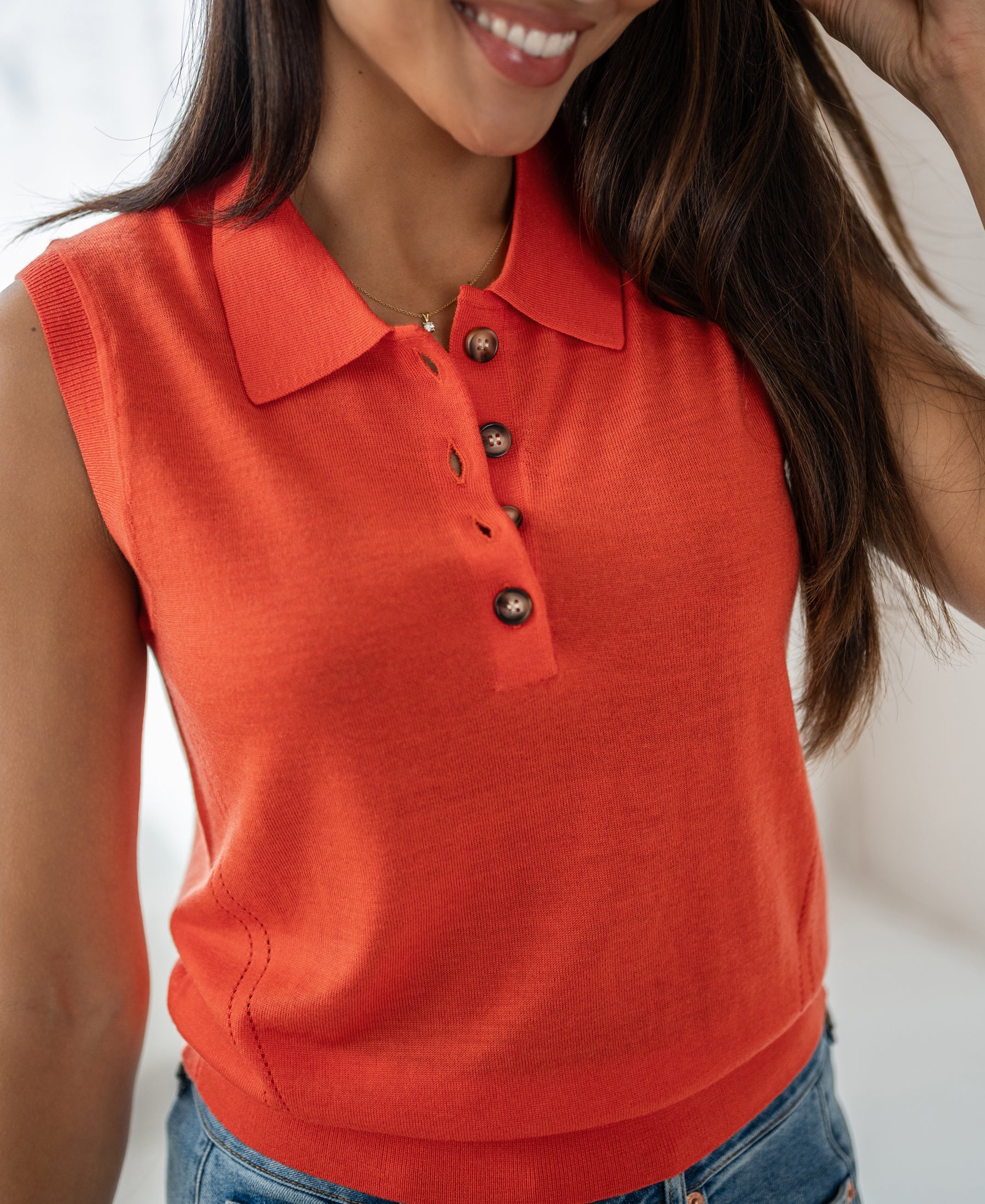 Sleeveless fine-knit polo top LE CLUB Coral by PLEIN PUBLIQUE, orange, with buttons.