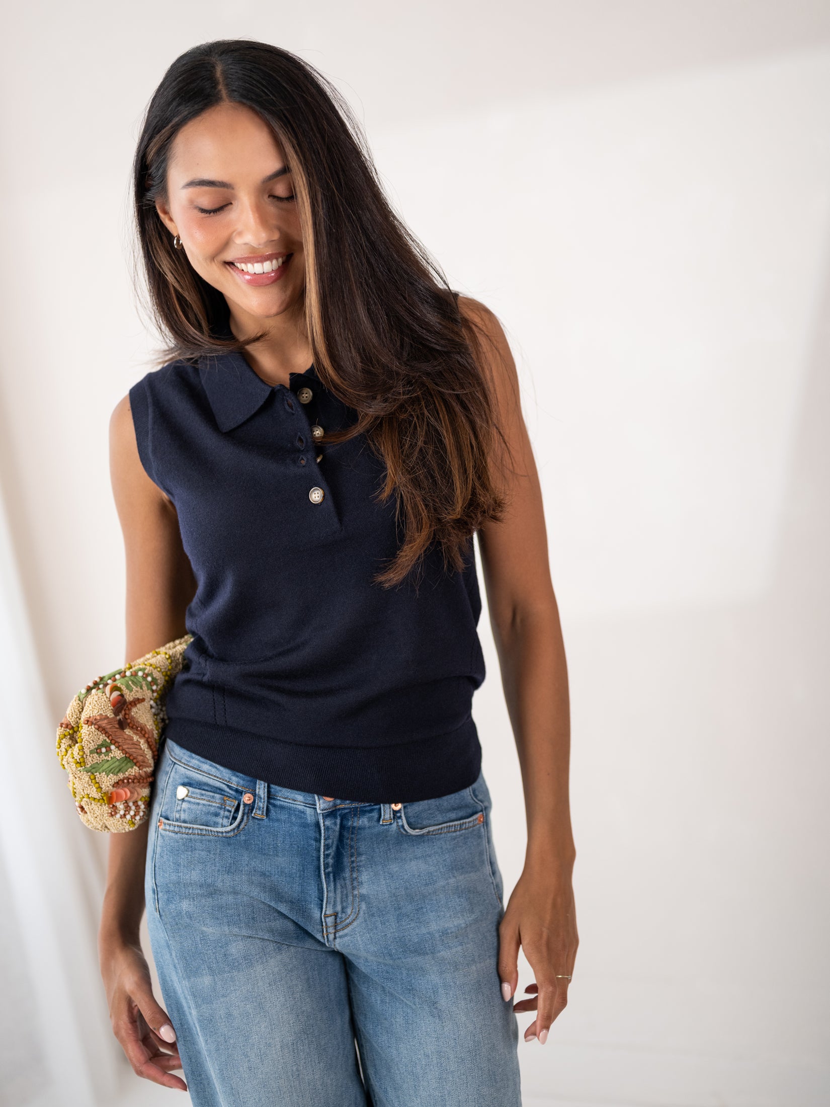 Sleeveless navy blue polo top by PLEIN PUBLIQUE.