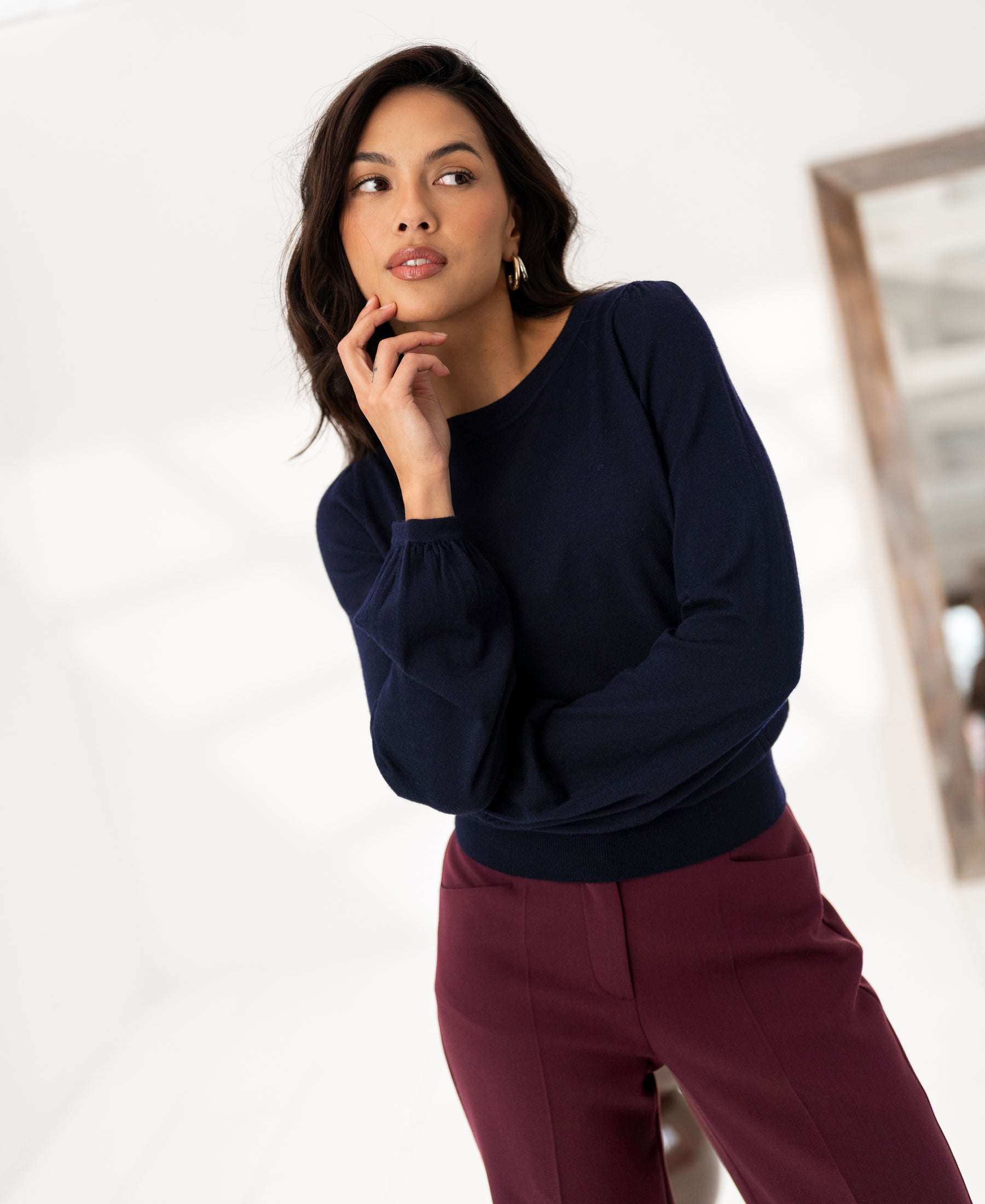 Navy blue Plein Publique merino wool sweater LA COEUR shown on model in a bright room.