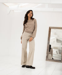 A beige PLEIN PUBLIQUE Merino wool sweater, style LA COEUR, shown in sand color.