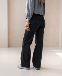 Wide leg black denim jeans by Plein Publique.