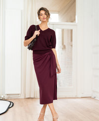 Burgundy Travel Skirt LE MAEL by PLEIN PUBLIQUE shown in a bright room with wooden floors.