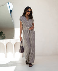 PLEIN PUBLIQUE LA DILOU blouse in ivory-cacao stripes, shown indoors with mirror behind.