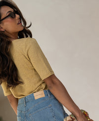 Mustard yellow linen T-shirt, side view.
