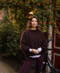 Woman wearing the PLEIN PUBLIQUE LA DOUCE mohair sweater in reddish brown.
