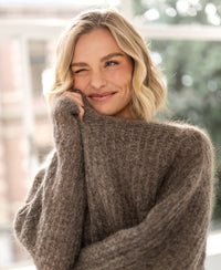 Light brown mohair sweater in an indoor setting.