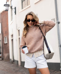 Woman wears PLEIN PUBLIQUE's mohair LA DOUCE Fudge sweater.