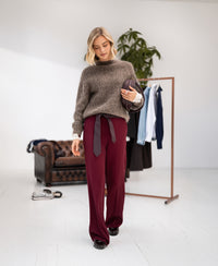 Light brown mohair sweater by PLEIN PUBLIQUE, shown worn by a woman.