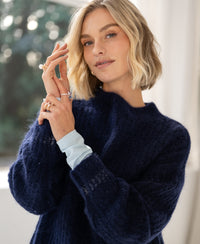 Navy blue PLEIN PUBLIQUE mohair sweater, semi-oversized fit, shown indoors in soft light.