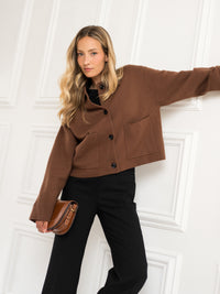 Camel wool jacket LA FAYE by PLEIN PUBLIQUE shown against a white wall.